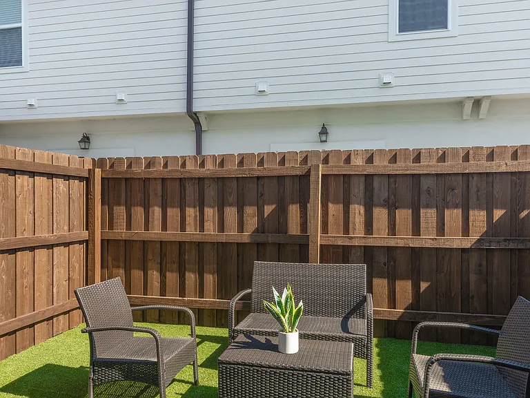 Relax in this cozy outdoor patio, perfect for enjoying sunny days.