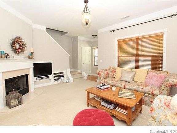 Living room with gas fire place and built in media storage