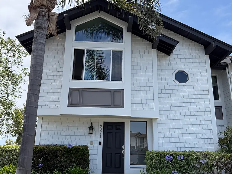 Front of condo. Enter below, and walk up stairs to all rooms on the upper level. Beautiful views from upstairs, with a spacious balcony for unparalleled sunset views.
