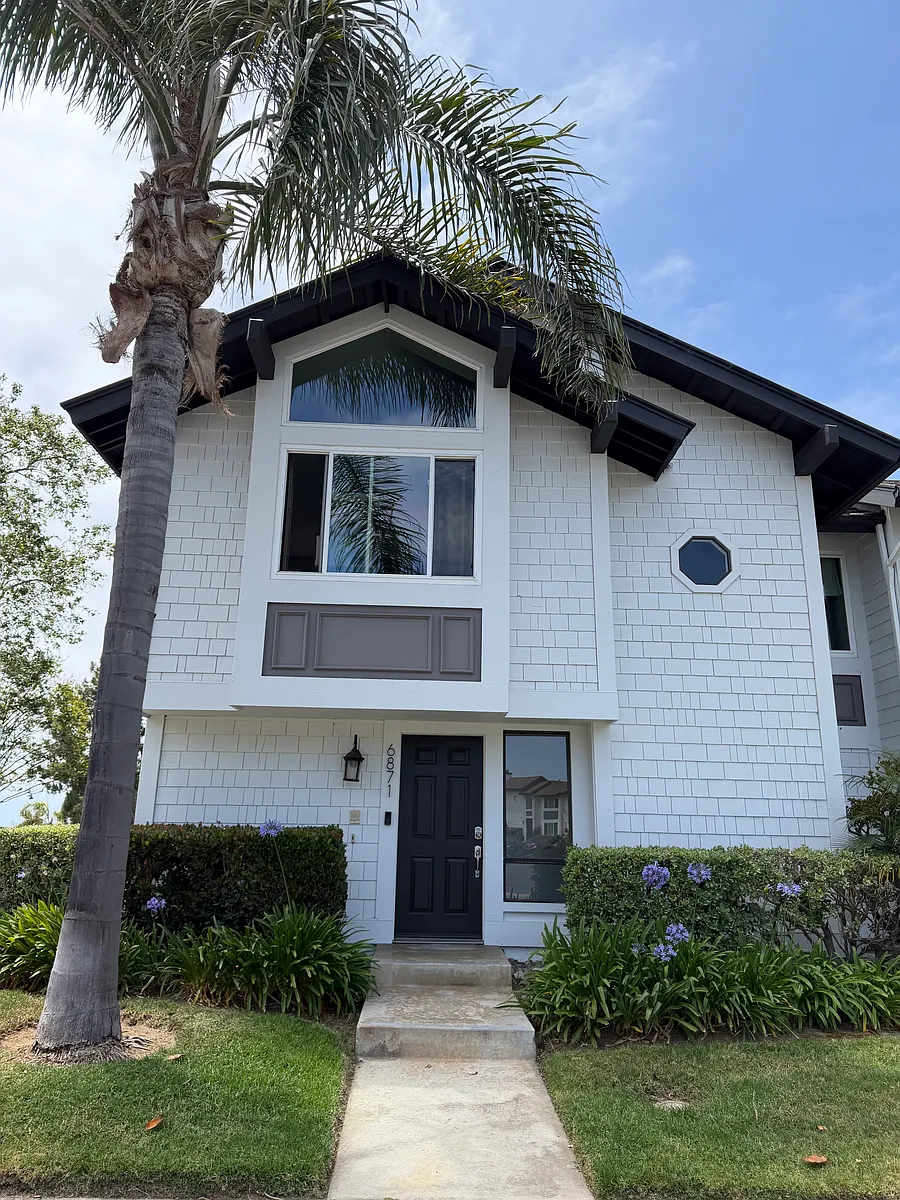 Front of condo. Enter below, and walk up stairs to all rooms on the upper level. Beautiful views from upstairs, with a spacious balcony for unparalleled sunset views. - 6871 Carnation Dr