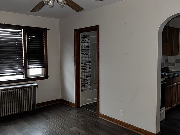 Livingroom looking into kitchen and bathroom