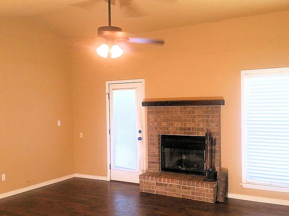 Living room with wood burning fireplace
