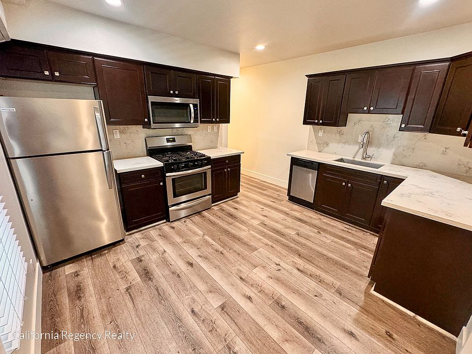Modern and updated kitchen with refrigerator, range, microwave, and dishwasher included!