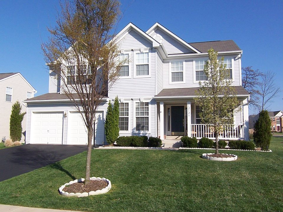 front of home, backs to woods 