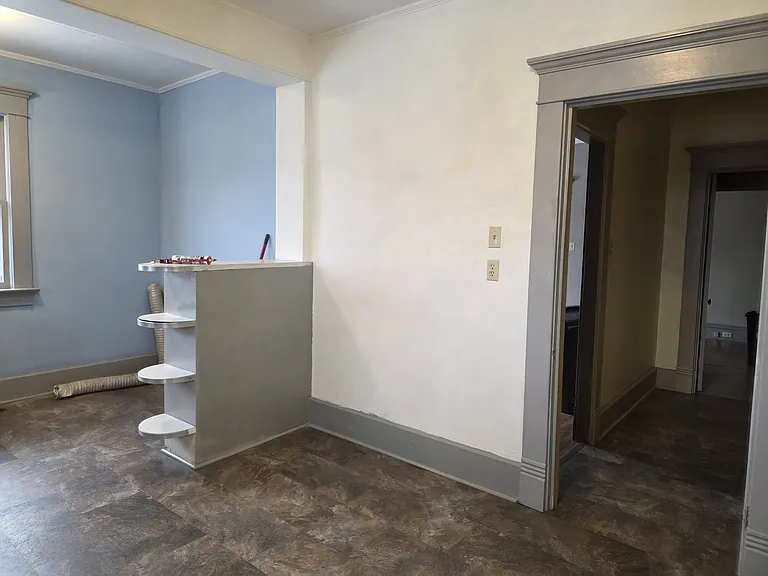 Kitchen viewing into the hallway leading to the 1/2 bath and dining room with the laundry room on the left.