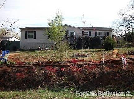 View from the street/CamdenDrive
						:
						Nandinas on the front bank