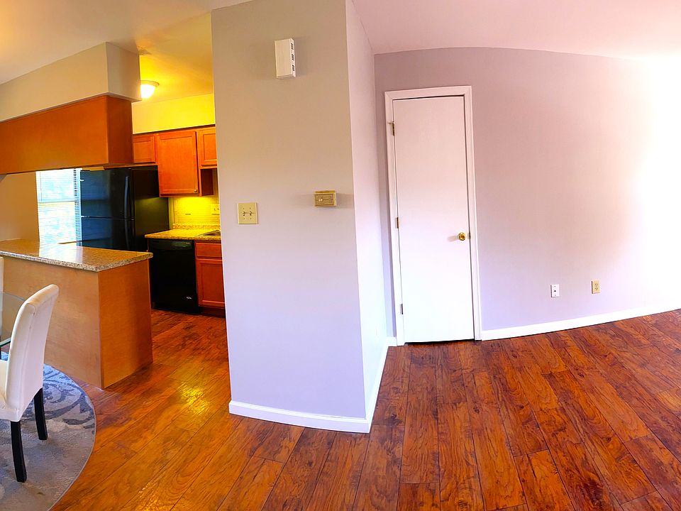 Panoramic View of Living Room, Dining, and Kitchen