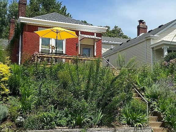 West facing porch/patio gets wonderful sunsets. Yard maintenance is included in rent.