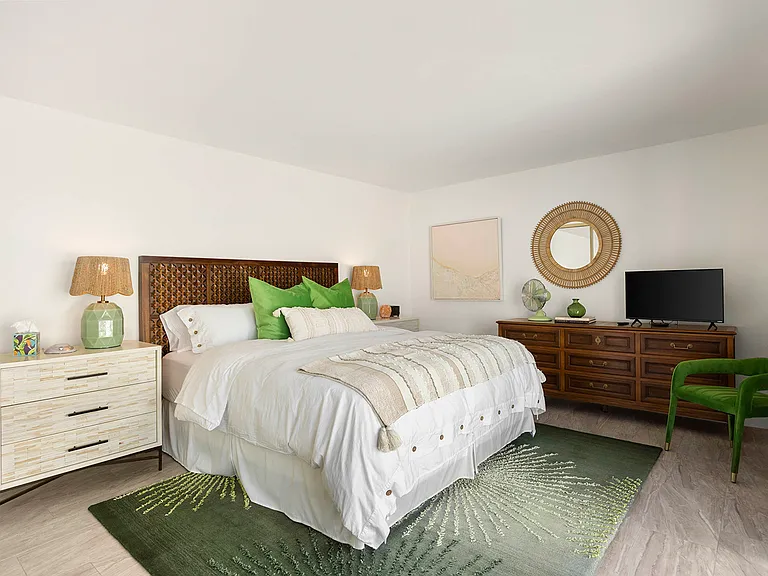 Primary Suite with Cal King Bed. This room has direct access to front patio leading to pool area.