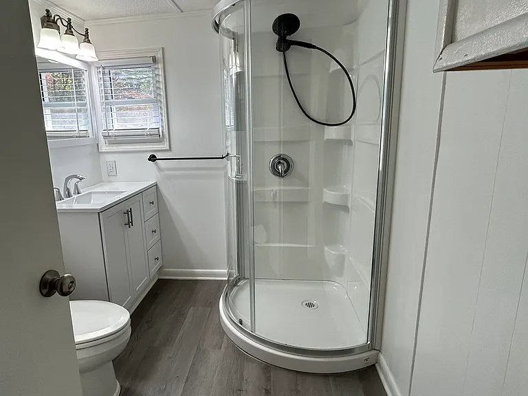 Next door on left is the first bathroom featuring shower. Linen closet on the left.