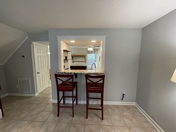 Kitchen Pass-through/bar, great for entertaining and accessible from Living Room