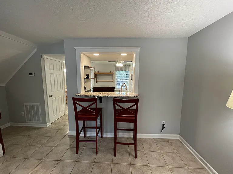 Kitchen Pass-through/bar, great for entertaining and accessible from Living Room