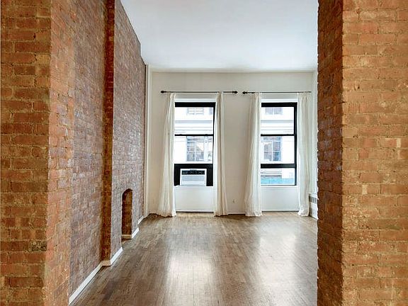 5th image of 23 E 10th St APT 209