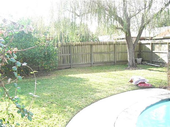 You still have plenty of yard for gatherings. Mature Lemon tree waits you.