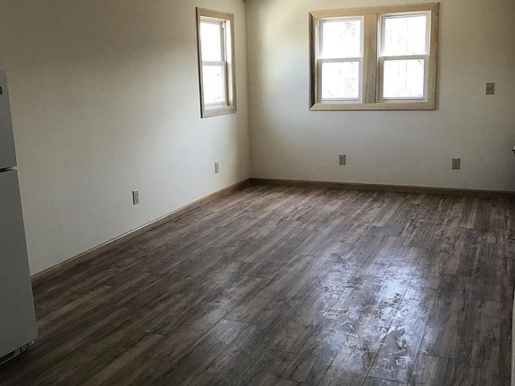 Lots of light, new windows and beautiful wooden floors.