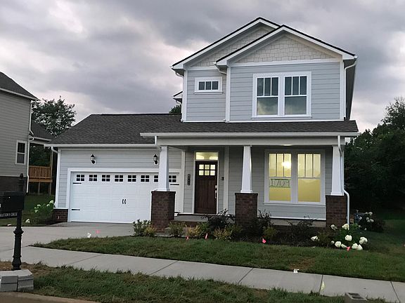 Enjoy sunset views from front porch. Front yard is landscaped and has irrigation system.