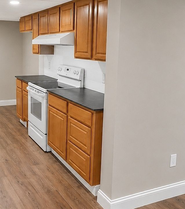 AI-modified to show eventual Kitchen (from LR); Kitchen floor will gray, wood-graining planking