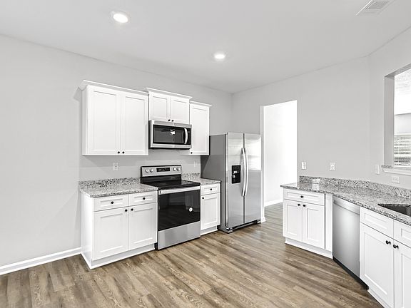 Gorgeous white cabinets with hardware in the Burton by LGI Homes
