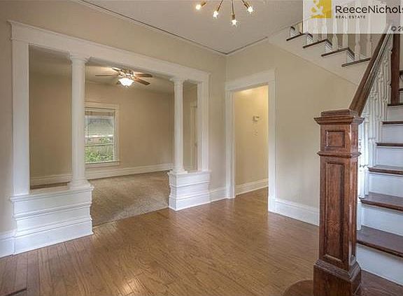 View from Foyer into Living Room.  Hall leads to 1/2 Bath, Kitchen, and Mud Room.  All bedrooms upstairs.