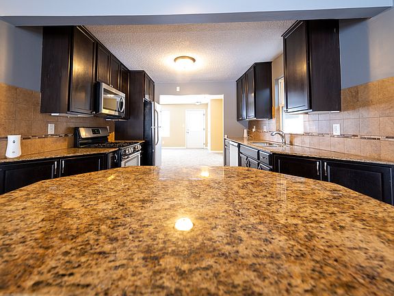 Large kitchen with lots of new appliances