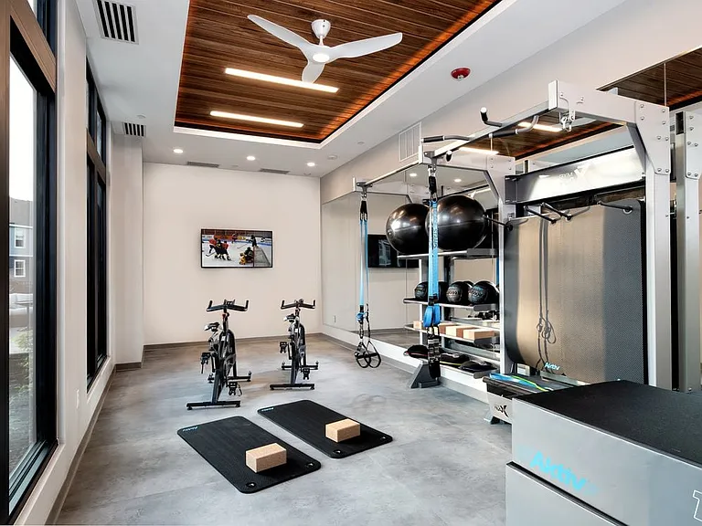 Fitness studio with spin bikes and TRX equipment