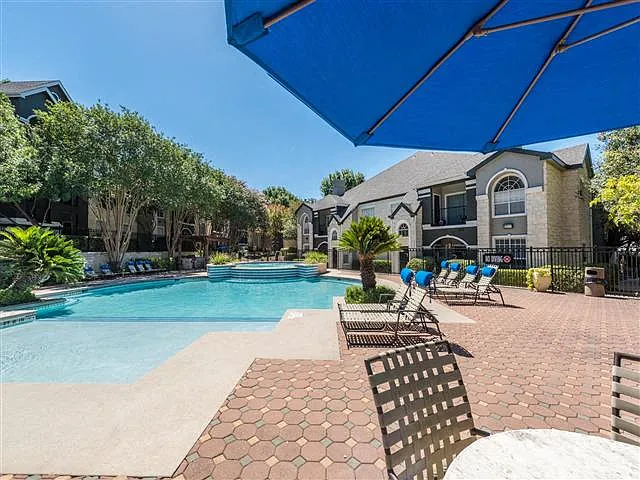 Pool with poolside lounge and shade seating