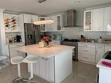 Custom made kitchen with wine bar and over size Island