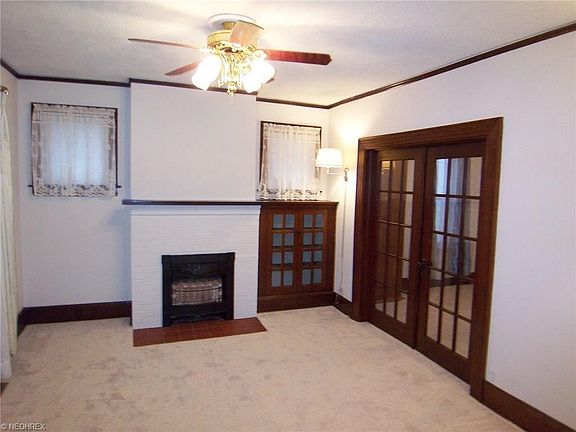 Living Room with Built In and French Doors
