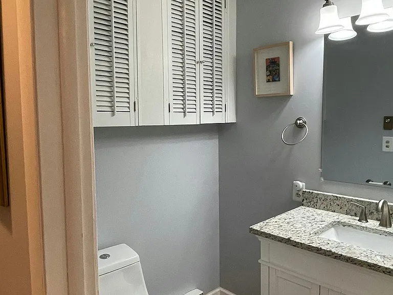 The full bath has plenty of extra storage