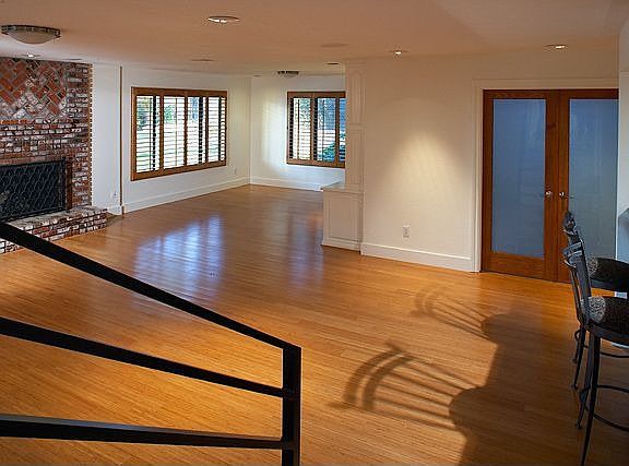 Huge family room includes a built-in bookcase, wet bar, and fireplace.
