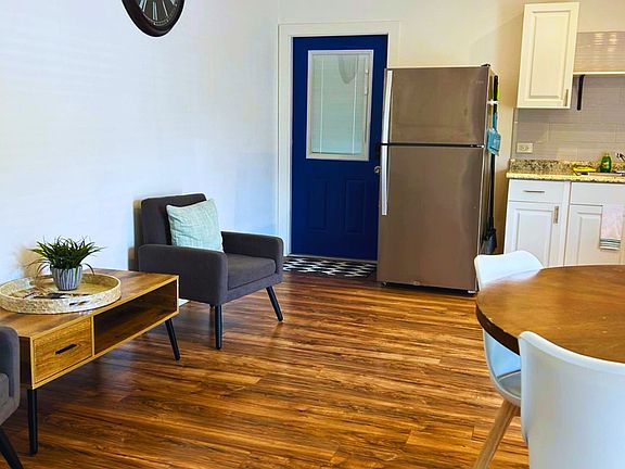 Bright studio with a spacious kitchen and dining table for four.