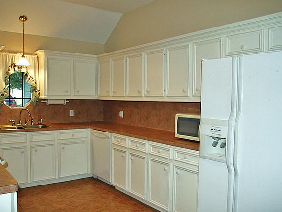 The kitchen is spacious and offers plenty of storage! Refrigerator is included!