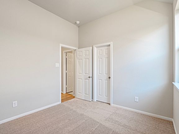 An additional view of the second bedroom and walk in closet.