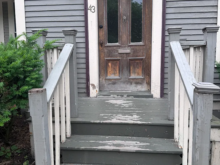 Front door - leads to vestibule and entry door