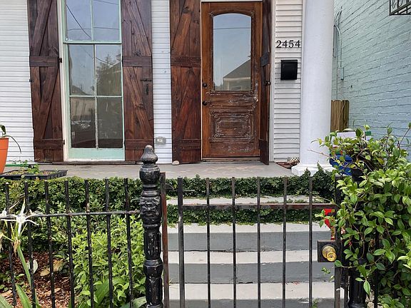 Entry to 2454 N Villere. Shutters can be opened for extra light or closed for privacy and security.