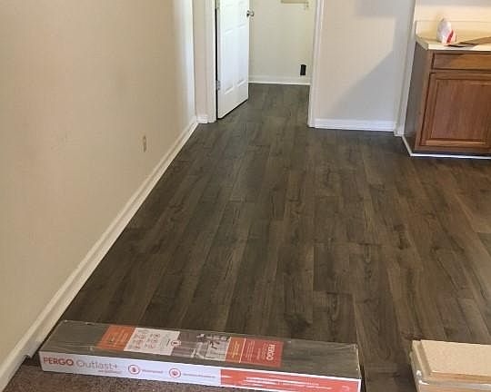 New hardwood floors throughout kitchen into laundry room