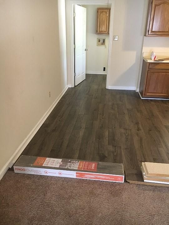 New hardwood floors throughout kitchen into laundry room