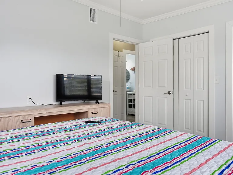 Bedroom #1 with Queen Bed and lots of closet space and 42 inch TV.