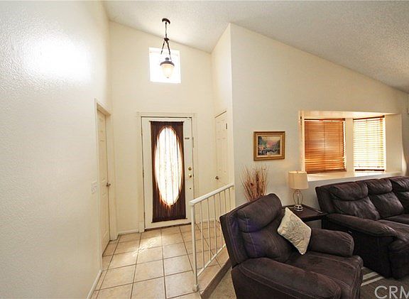 Vaulted ceiling continues over the formal living room