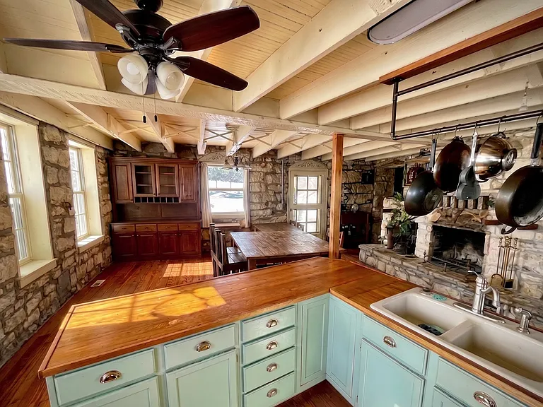 Stunning historic stone details meet an large layout kitchen.