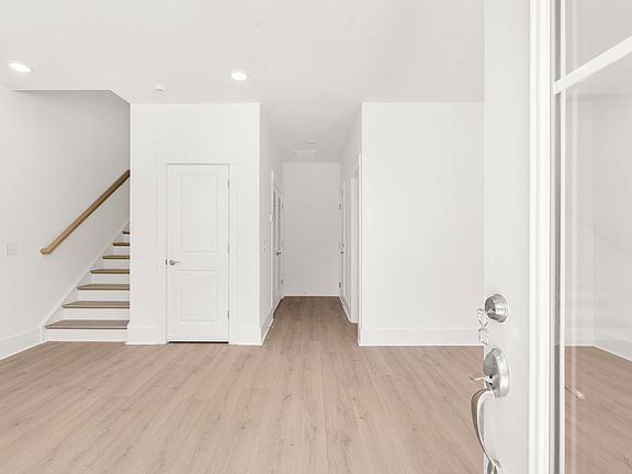 Entrance inside townhome, 1 large space, 2 car garage off the back of the home plus large storage closet on 1st floor.