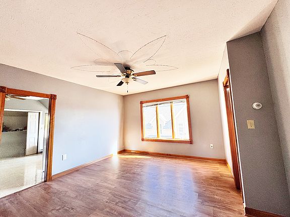 Living looking into kitchen and kitchen's storage space.