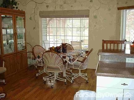 Kitchen
						:
						Appliances included  JENN-AIR counter top stove. Snack Bar.