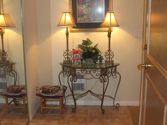 Entry foyer with large coat closet.