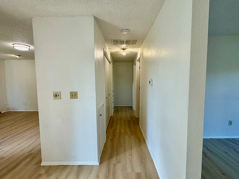 Hallway to bedrooms and bathroom
