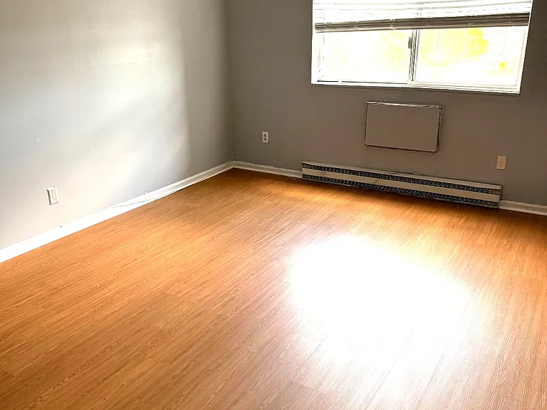 Another angle of the bedroom showing the room size