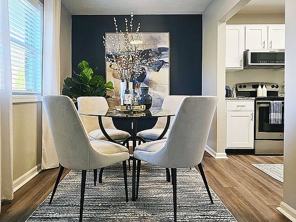 Dining area with hardwood-style flooring