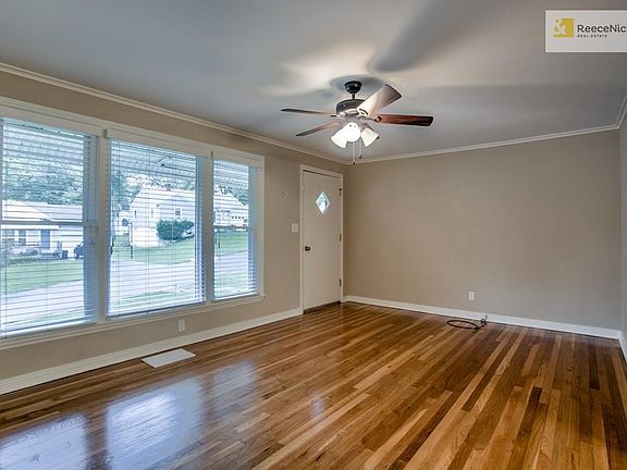 Spacious living room with rich wood floors.  Plenty of space to entertain.