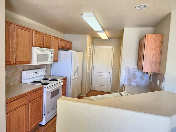 Kitchen: white electric range will be replaced