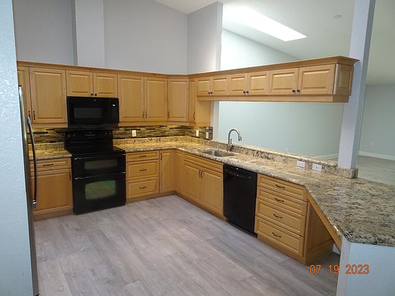 Under cabinet lighting gives ambience to a beautifull granite countertop.